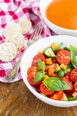 Tomato salad with cucumber and croutons