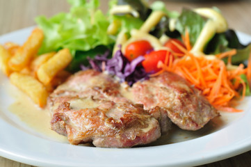 Pork steak with mix vegetables and french fried potatoes
