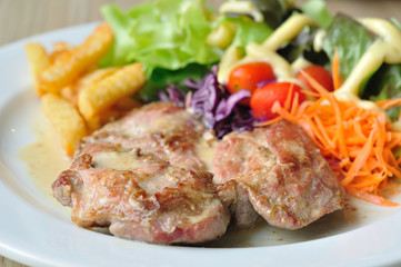 Pork steak with mix vegetables and french fried potatoes