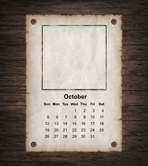 Calendar 2014, vintage paper on wood background