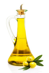 Olive oil in a glass bottle and olives isolated over a white bac