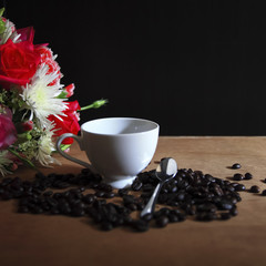 Coffee beans and cup of coffee background 