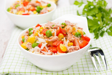 colorful salad with corn, green peas, rice, red pepper and tuna