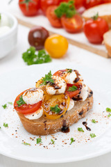 piece of ciabatta with mozzarella and colorful cherry tomatoes