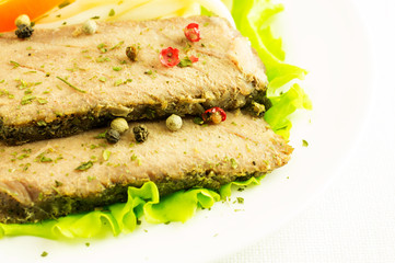 Beef with pasta, salad, sweet pepper on a plate.