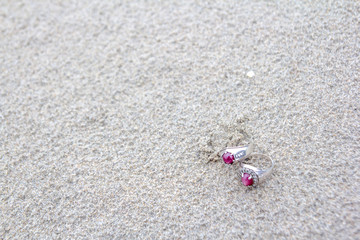 Fototapeta na wymiar Two Rings on sand