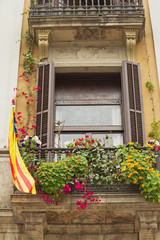 Fototapeta na wymiar Window with a Catalan Flag.