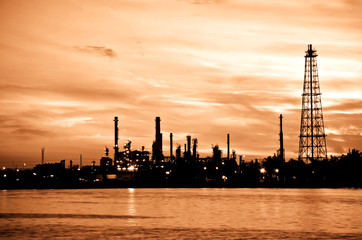Petroleum oil refinery factory over sunrise