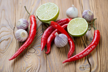 Thai cooking ingredients: chili pepper, lime and garlic