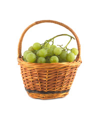 Green grape bunch with green berries wicker basket isolated