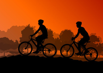 Obraz premium Active cyclists bicycle riders in wild forest nature landscape b