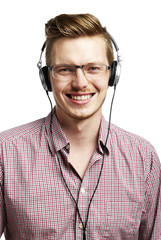 Listens to the music and smiles