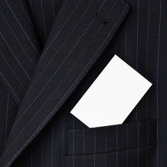 Suit with blank business card in pocket