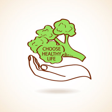 Illustration of human hand holding broccoli