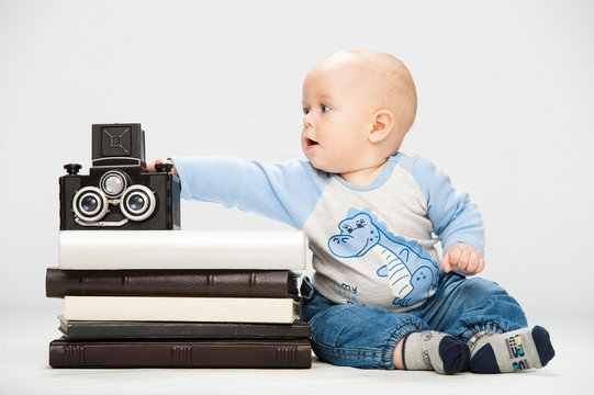 little boy with a film camera