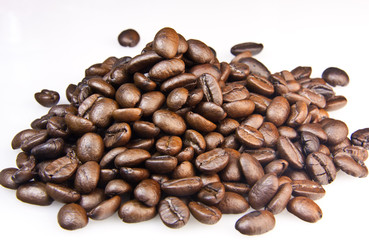 Brown coffee beans isolated on white background