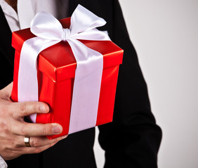 close up of man hands holding gift box
