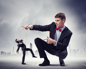 Businessman puppeteer