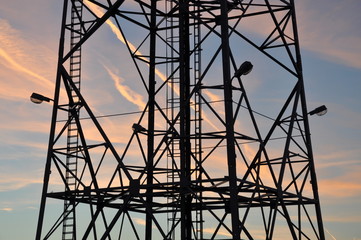 Silhouette of a steel tower at sunset