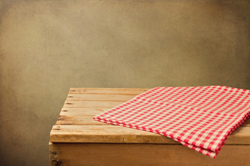 Vintage background with empty wooden table and tablecloth