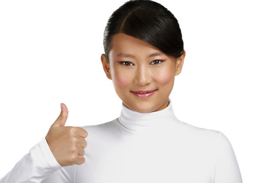 Beautiful happy asian girl showing thumbs up