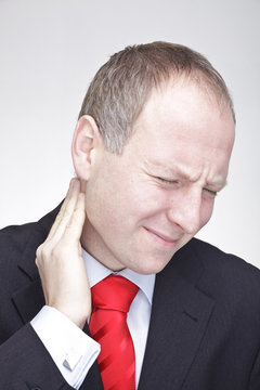 Businessman with neck pain