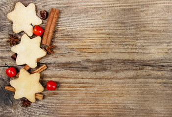 Christmas cookies on wooden background. Copy space, blank board