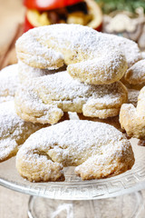 Stack of christmas croissants on glass cake stand