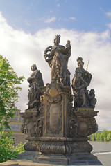 Ancient sculpture on the Charles Bridge. Prague. St. Barbara, Ma