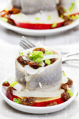 Pickled herring rolls with vegetables