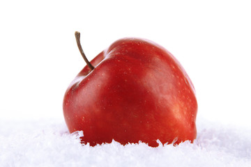 Red apple in snow isolated on white © Africa Studio