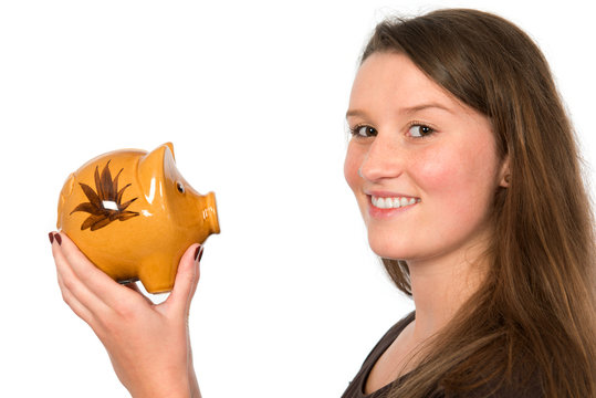 smiling young woman with piggy bank