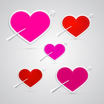 Vector paper red, pink hearts pierced with arrows