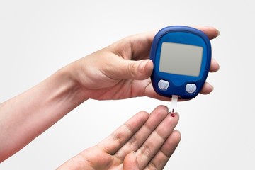 Woman doing blood sugar test