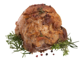 freshly roasted domestic pork with herbs on white