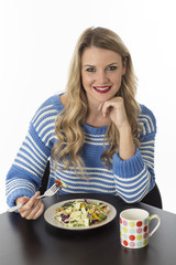 Attractive Young Woman Eating Mixed Vegetables