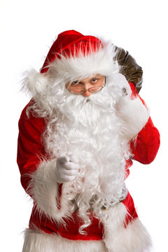 Santa Claus pointing to the camera isolated on white