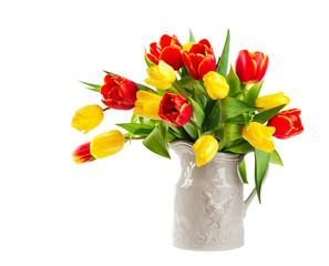 Red and yellow tulips in a jug