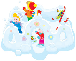 Children playing snowballs in a snow fortress