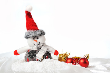Snowman with gifts in the snow