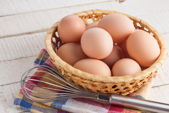 Chicken eggs on wooden background