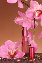 Obraz na płótnie Canvas Women's perfume in beautiful bottle with orchids