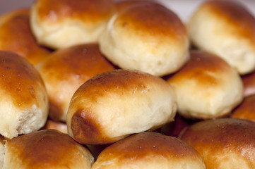 Hot pasties (patties) on baking tray close up