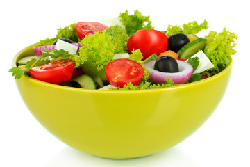 Greek salad on plate isolated on white