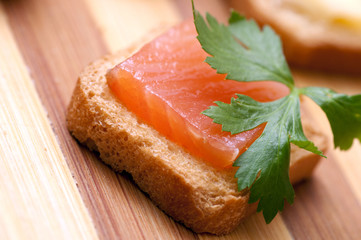 Small snacks with salmon for buffet