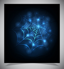 Glowing spider web on a dark background