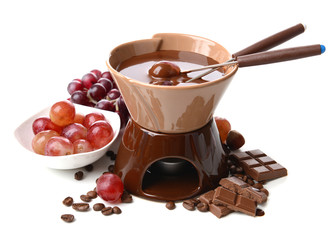 Chocolate fondue with fruits, isolated on white