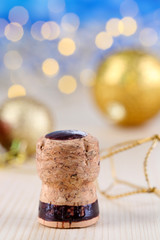Champagne cork on Christmas lights background