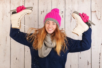 Woman in winter with ice skates - obrazy, fototapety, plakaty