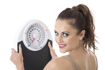 Young Woman Holding Weighing Scales